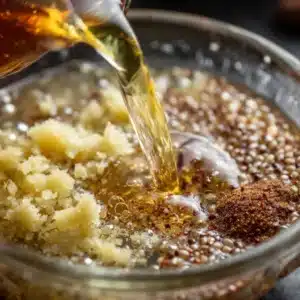 Lemon and ginger being added to a glass with soaked chia seeds for a healthy drink.